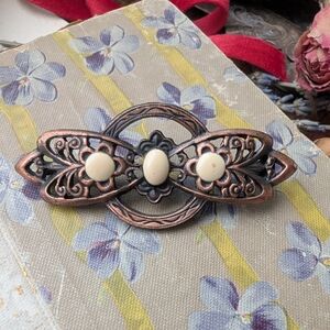 Vintage Bronze Brooch With Cream Enamel Design